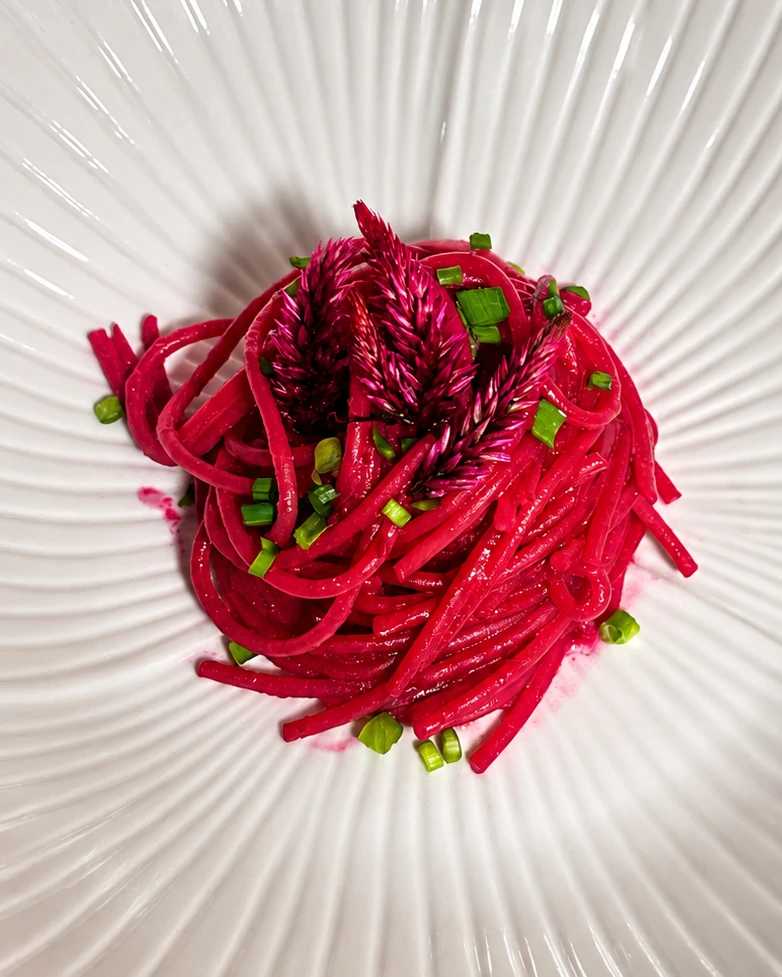 Glossy Beetroot and Garlic Pasta · Beetroot, garlic, floral garnish