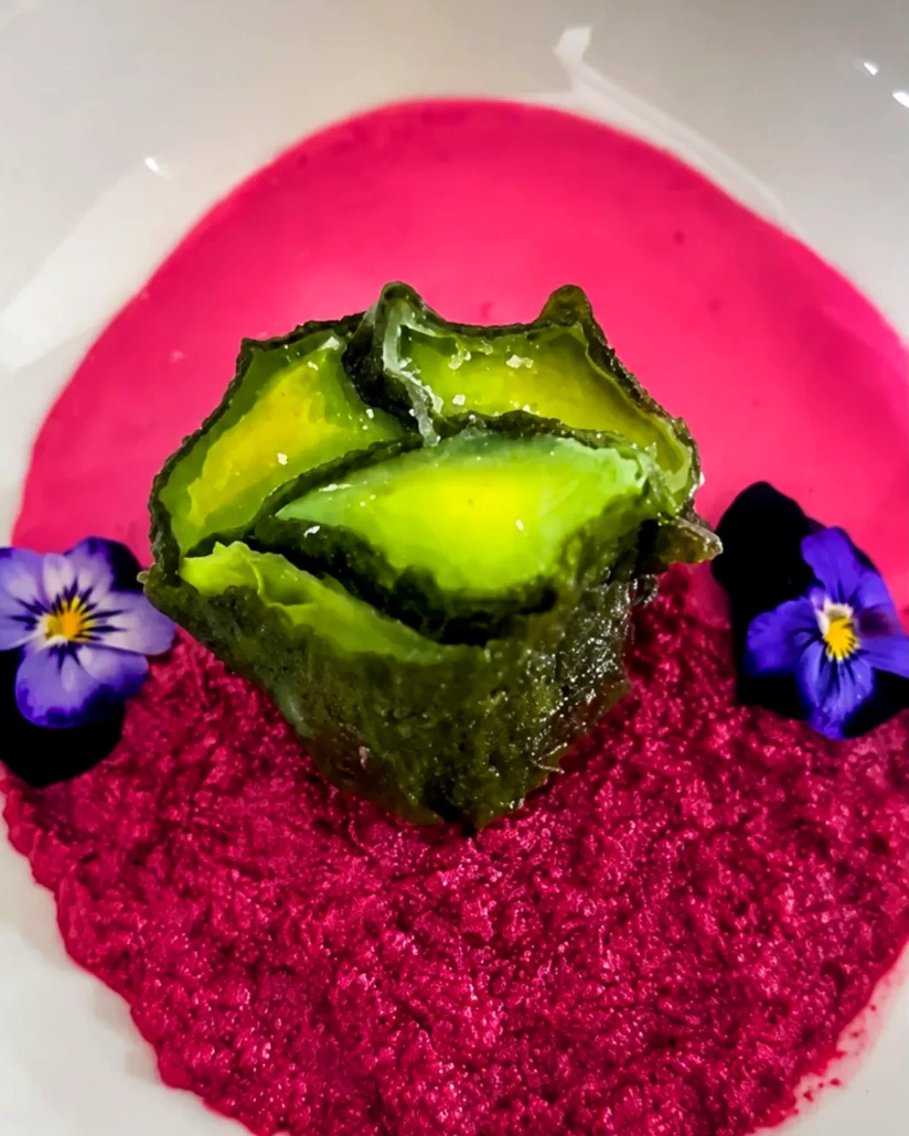 The Pink Table · Vivid pink purée, a green centre and purple edible flowers