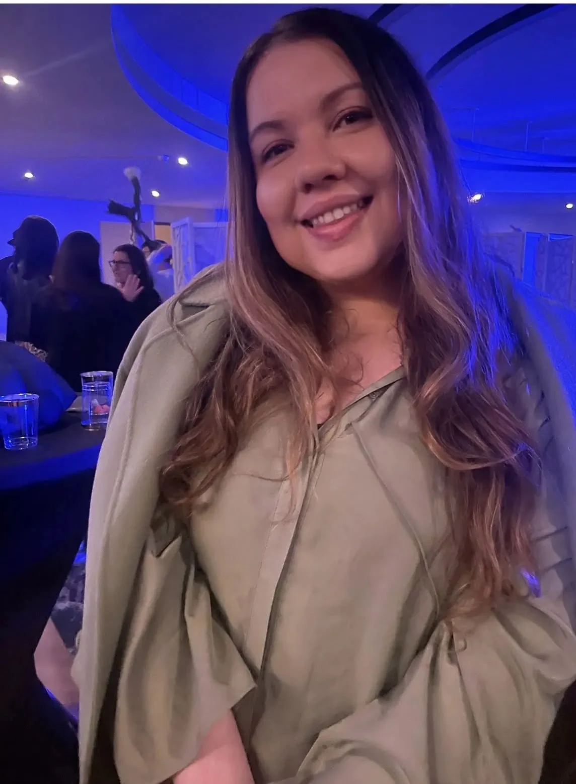 Alexandra · Portrait in olive green at an evening event